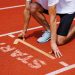 athlete at starting line readies for sprint, focusing on race and have fast decision making
